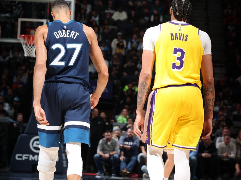 MINNEAPOLIS, MN -  DECEMBER 13:  Rudy Gobert #27 of the Minnesota Timberwolves and Anthony Davis #3 of the Los Angeles Lakers look on during the game on December 13, 2024 at Target Center in Minneapolis, Minnesota. NOTE TO USER: User expressly acknowledges and agrees that, by downloading and or using this Photograph, user is consenting to the terms and conditions of the Getty Images License Agreement. Mandatory Copyright Notice: Copyright 2024 NBAE (Photo by David Sherman/NBAE via Getty Images)