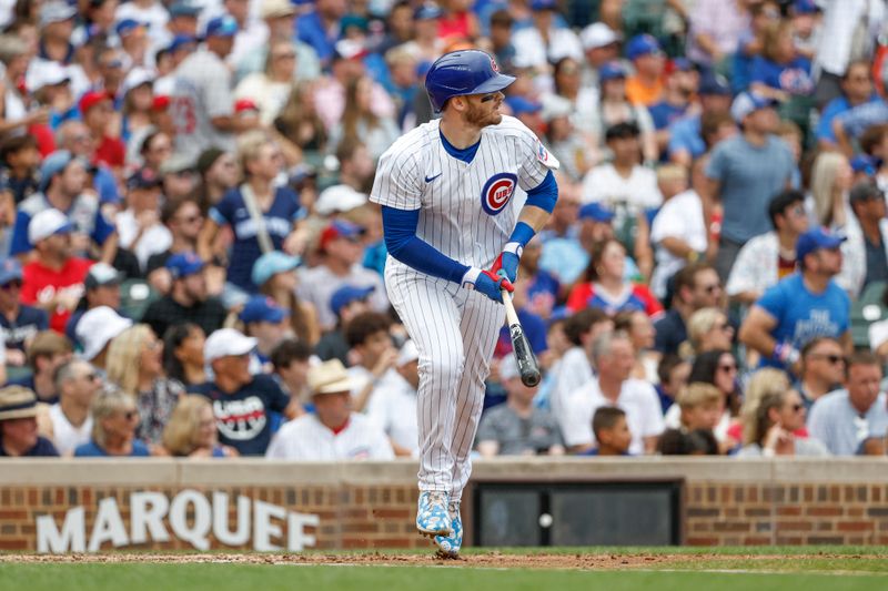 Jul 4, 2024; Chicago, Illinois, USA; Chicago Cubs outfielder Ian Happ (8) watches his three-run home run against the Philadelphia Phillies during the fourth inning at Wrigley Field. Mandatory Credit: Kamil Krzaczynski-USA TODAY Sports