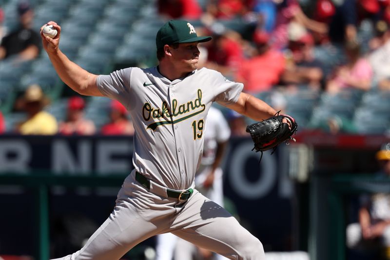 Jun 26, 2024; Anaheim, California, USA;  Oakland Athletics relief pitcher Mason Miller (19) pitches during the eighth inning against the Los Angeles Angels at Angel Stadium. Mandatory Credit: Kiyoshi Mio-USA TODAY Sports