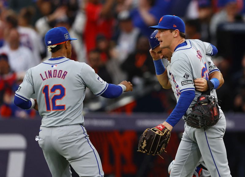 [US, Mexico & Canada customers only] June 9, 2024; London, UNITED KINGDOM;  New York Mets players Drew Smith, Luis Torrens and Francisco Lindor celebrate after defeating the Philadelphia Phillies during a London Series baseball game at Queen Elizabeth Olympic Park. Mandatory Credit: Matthew Childs/Reuters via USA TODAY Sports