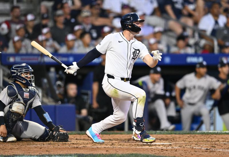 Aug 18, 2024; Williamsport, Pennsylvania, USA; Detroit Tigers infielder Colt Keith (33) hits a single against the New York Yankees in the fourth inning at BB&T Ballpark at Historic Bowman Field. Mandatory Credit: Kyle Ross-USA TODAY Sports