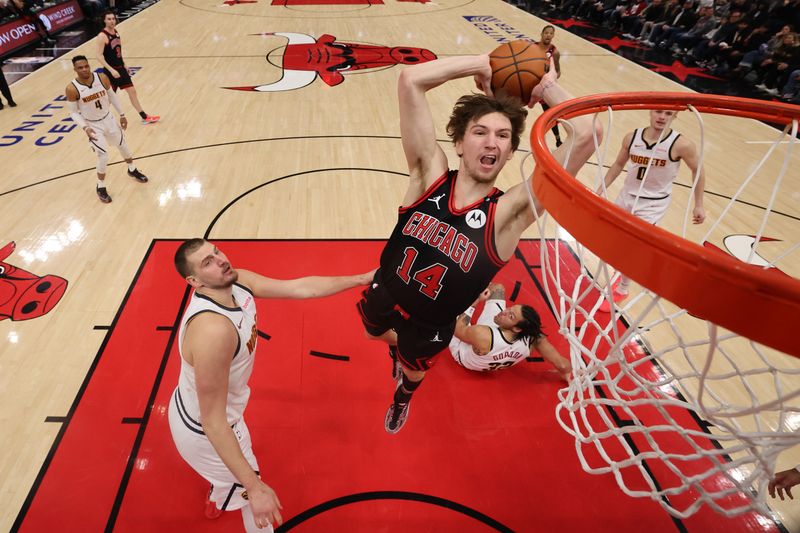 CHICAGO, ILLINOIS - JANUARY 27: Matas Buzelis #14 of the Chicago Bulls goes up for a dunk against the Denver Nuggets during the second half at the United Center on January 27, 2025 in Chicago, Illinois. NOTE TO USER: User expressly acknowledges and agrees that, by downloading and or using this photograph, User is consenting to the terms and conditions of the Getty Images License Agreement.  (Photo by Michael Reaves/Getty Images)