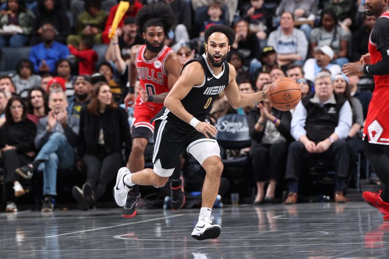 MEMPHIS, TN - FEBRUARY 8: Jacob Gilyard #0 of the Memphis Grizzlies dribbles the ball during the game against the Chicago Bulls on February 8, 2024 at FedExForum in Memphis, Tennessee. NOTE TO USER: User expressly acknowledges and agrees that, by downloading and or using this photograph, User is consenting to the terms and conditions of the Getty Images License Agreement. Mandatory Copyright Notice: Copyright 2024 NBAE (Photo by Joe Murphy/NBAE via Getty Images)