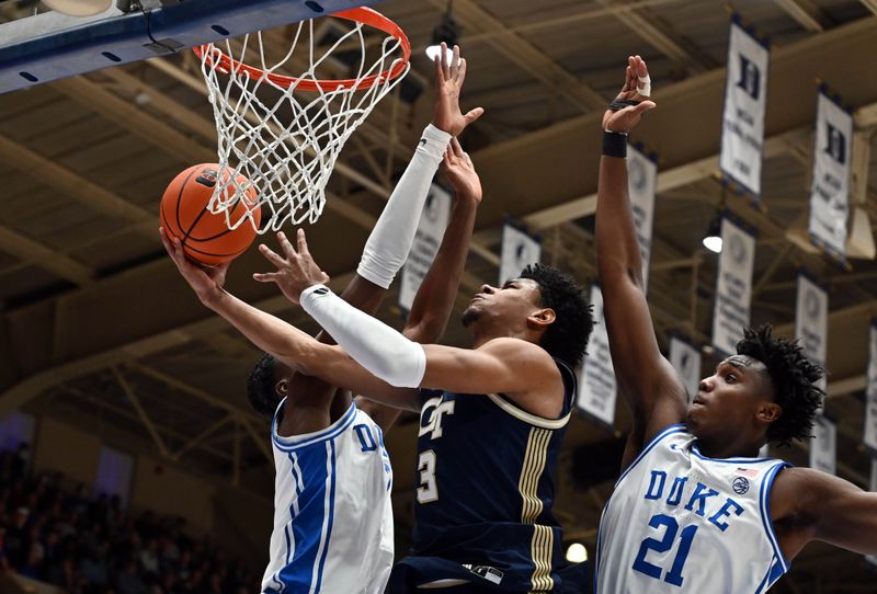 Dec 31, 2025; Durham, North Carolina, USA; Georgia Tech Yellow Jackets guard Jaeden Mustaf (3) lays the ball up in front of Duke Blue Devils center Patrick Ngongba II (21)during the first half at Cameron Indoor Stadium. Mandatory Credit: Rob Kinnan-Imagn Images