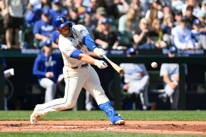 Sep 17, 2023; Seattle, Washington, USA; Seattle Mariners first baseman Ty France (23) hits a single against the Los Angeles Dodgers during the second inning at T-Mobile Park. Mandatory Credit: Steven Bisig-USA TODAY Sports