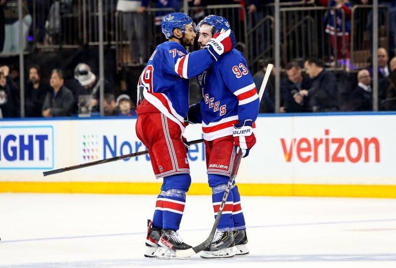 Jan 18, 2025; New York, New York, USA; New York Rangers defenseman K'Andre Miller (79) celebrates with center Mika Zibanejad (93) after a 1-0 shootout win against the Columbus Blue Jackets at Madison Square Garden. Mandatory Credit: Danny Wild-Imagn Images