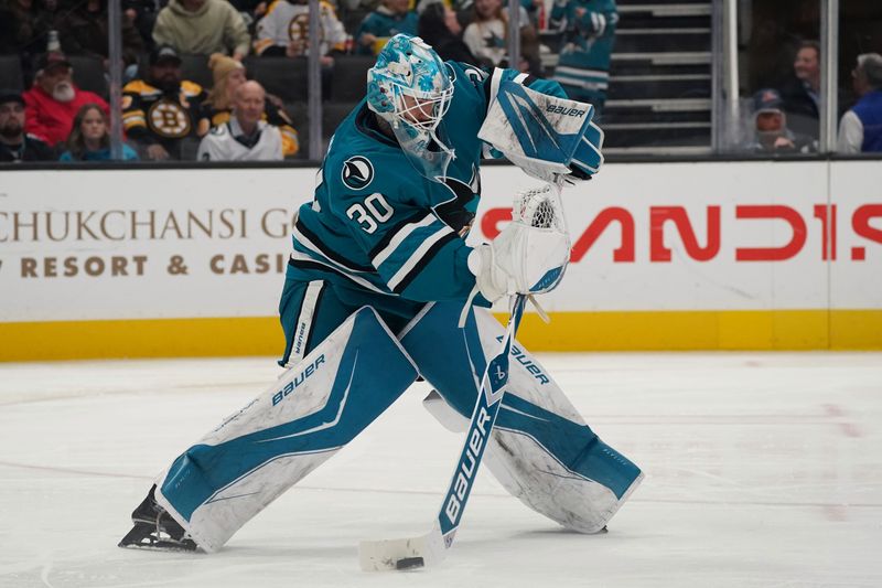 Nov 23, 2025; San Jose, California, USA;  San Jose Sharks goaltender Yaroslav Askarov (30) passes the puck during a game against the Boston Bruins in the third period at SAP Center in San Jose. Mandatory Credit: David Gonzales-Imagn Images