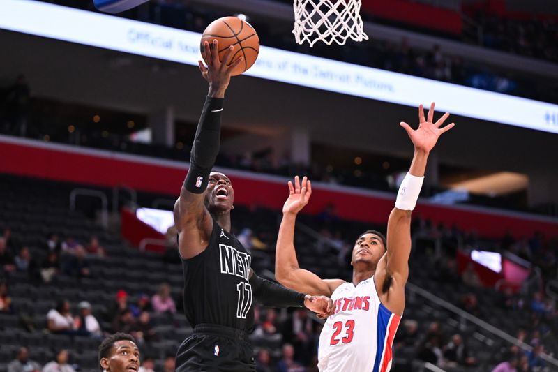 DETROIT, MICHIGAN - MARCH 07: Dennis Schroder #17 of the Brooklyn Nets shoots the ball against Jaden Ivey #23 of the Detroit Pistons during the second half at Little Caesars Arena on March 07, 2024 in Detroit, Michigan. NOTE TO USER: User expressly acknowledges and agrees that, by downloading and or using this photograph, User is consenting to the terms and conditions of the Getty Images License Agreement. (Photo by Luke Hales/Getty Images)