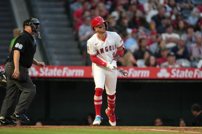 Apr 30, 2024; Anaheim, California, USA; Los Angeles Angels shortstop Zach Neto (9) hits a home run in the third inning against the Philadelphia Phillies at Angel Stadium. Mandatory Credit: Kirby Lee-USA TODAY Sports