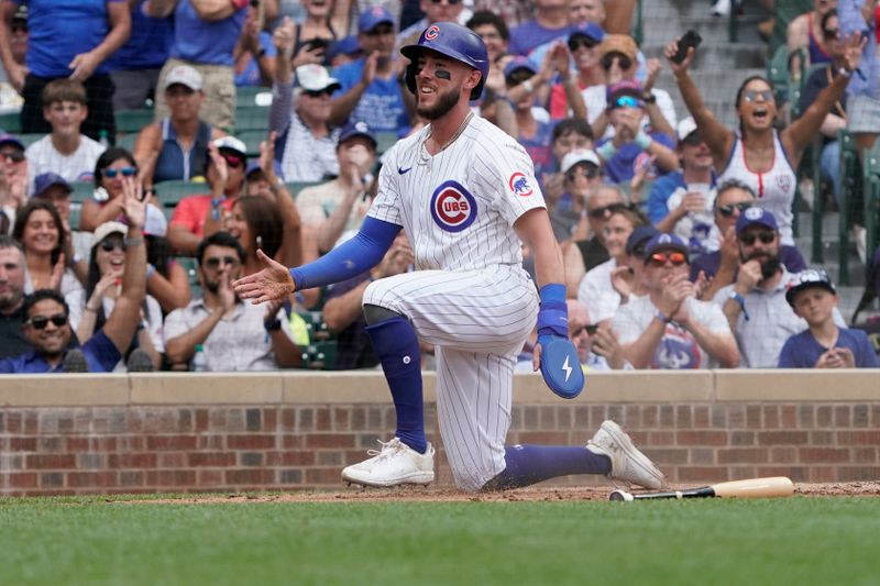 Jul 7, 2024; Chicago, Illinois, USA; Chicago Cubs third baseman Miles Mastrobuoni (20) is safe at home plate against the Los Angeles Angels during the third inning at Wrigley Field. Mandatory Credit: David Banks-USA TODAY Sports