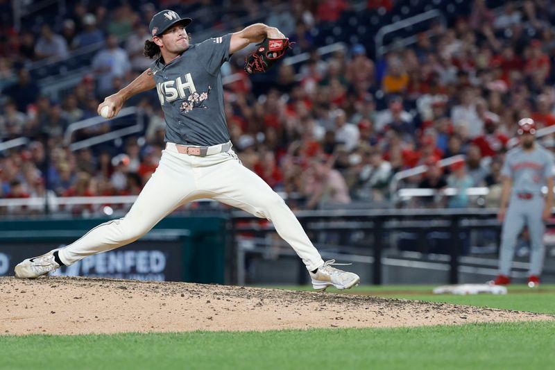 Jul 20, 2024; Washington, District of Columbia, USA; Washington Nationals relief pitcher Kyle Finnegan (67) pitches against the Cincinnati Reds during the ninth inning at Nationals Park. Mandatory Credit: Geoff Burke-USA TODAY Sports