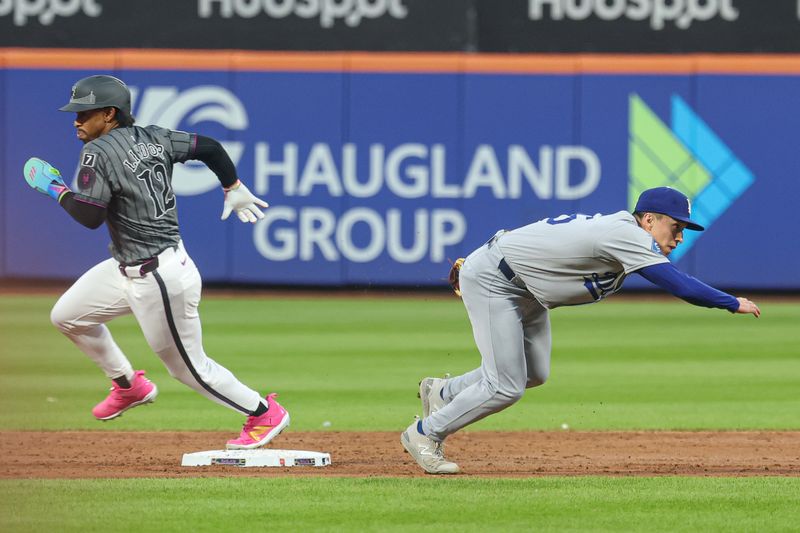 May 25, 2025; New York City, New York, USA; New York Mets shortstop Francisco Lindor (12) rounds second base after a throwing error as Los Angeles Dodgers center fielder Tommy Edman (25) can not field the ball during the third inning at Citi Field. Mandatory Credit: Vincent Carchietta-Imagn Images
