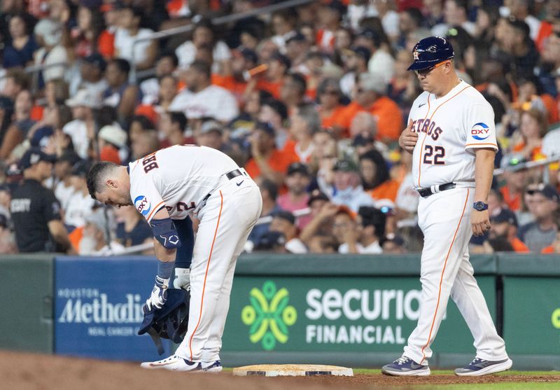 Jun 17, 2023; Houston, Texas, USA; Houston Astros third baseman Alex Bregman (2) removes his gear after flying out against the Cincinnati Reds with men in scoring position in the fifth inning at Minute Maid Park. Mandatory Credit: Thomas Shea-USA TODAY Sports