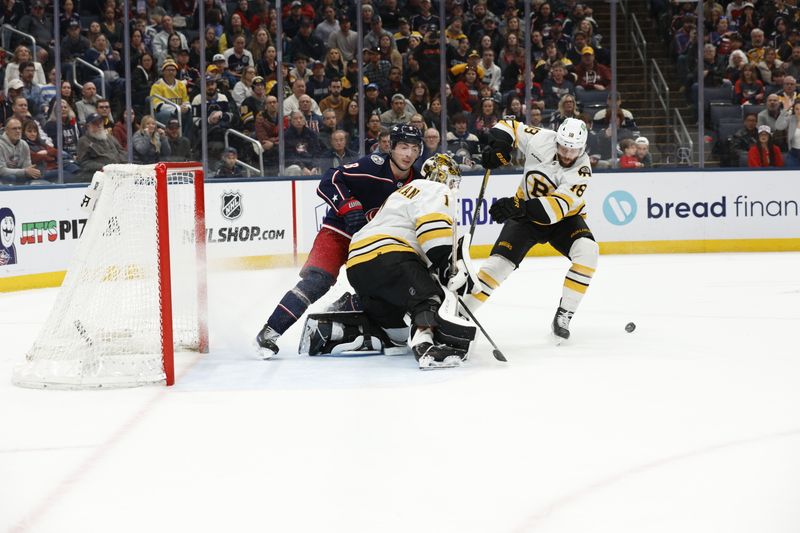 Mar 29, 2026; Columbus, Ohio, USA; Boston Bruins goalie Jeremy Swayman (1) makes a save on the shot from Columbus Blue Jackets defenseman Zach Werenski (8) during overtime at Nationwide Arena. Mandatory Credit: Russell LaBounty-Imagn Images