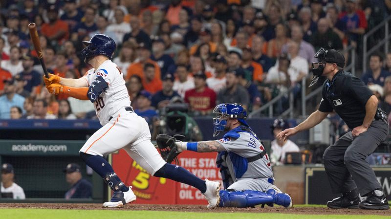 May 16, 2023; Houston, Texas, USA; Houston Astros center fielder Chas McCormick (20) hits a RBI double against there Chicago Cubs in the fourth inning at Minute Maid Park. Mandatory Credit: Thomas Shea-USA TODAY Sports