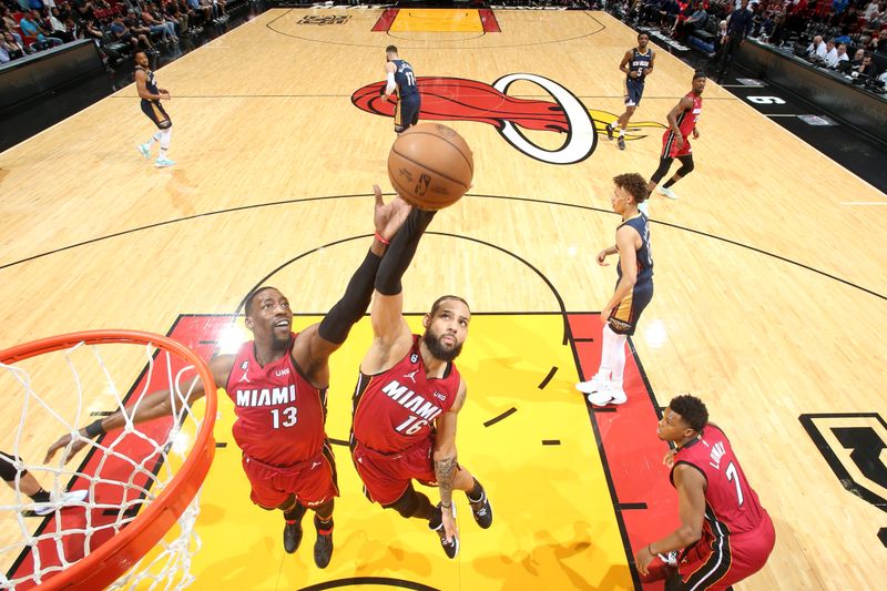 MIAMI, FL - JANUARY 22: Caleb Martin #16 of the Miami Heat rebounds the ball during the game against the New Orleans Pelicans on January 22, 2023 at Miami-Dade Arena in Miami, Florida. NOTE TO USER: User expressly acknowledges and agrees that, by downloading and or using this Photograph, user is consenting to the terms and conditions of the Getty Images License Agreement. Mandatory Copyright Notice: Copyright 2023 NBAE (Photo by Nathaniel S. Butler/NBAE via Getty Images)