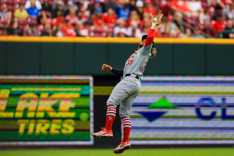 May 29, 2024; Cincinnati, Ohio, USA; St. Louis Cardinals third baseman Brendan Donovan (33) catches a pop up hit by Cincinnati Reds designated hitter Nick Martini (not pictured) in the fifth inning at Great American Ball Park. Mandatory Credit: Katie Stratman-USA TODAY Sports