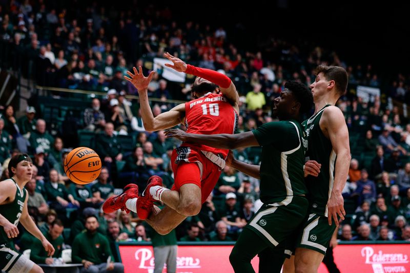 Mar 3, 2023; Fort Collins, Colorado, USA; New Mexico Lobos guard Jaelen House (10) reacts as Colorado State Rams guard Isaiah Stevens (4) knocks the ball away as forward Patrick Cartier (12) defends in the first half at Moby Arena. Mandatory Credit: Isaiah J. Downing-USA TODAY Sports