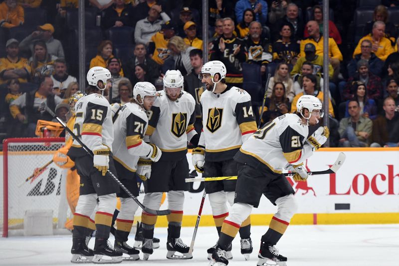 Mar 26, 2024; Nashville, Tennessee, USA; Vegas Golden Knights center Brett Howden (21) celebrates with teammates after a goal during the first period against the Nashville Predators at Bridgestone Arena. Mandatory Credit: Christopher Hanewinckel-USA TODAY Sports