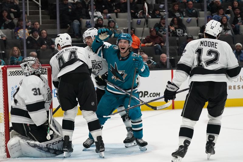 Nov 25, 2024; San Jose, California, USA; San Jose Sharks left wing William Eklund (72) celebrates after left wing Fabian Zetterlund (20) scores as Los Angeles Kings goalie David Rittich (31) and defenseman Mikey Anderson (44) and left winger Trevor Moore (12) look on  in the second period at SAP Center at San Jose. Mandatory Credit: David Gonzales-Imagn Images