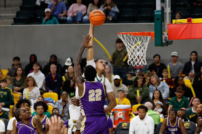 Dec 19, 2025; Waco, Texas, USA;  Baylor Bears guard Cameron Carr (43) scores a basket against Alcorn State Braves guard Mike Jones (22) during the first half at Paul and Alejandra Foster Pavilion. Mandatory Credit: Chris Jones-Imagn Images