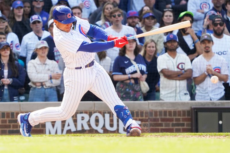 May 6, 2023; Chicago, Illinois, USA; Chicago Cubs pinch-hitter Miguel Amaya (6)gets his first MLB single against the Miami Marlins during the eighth inning at Wrigley Field. Mandatory Credit: David Banks-USA TODAY Sports