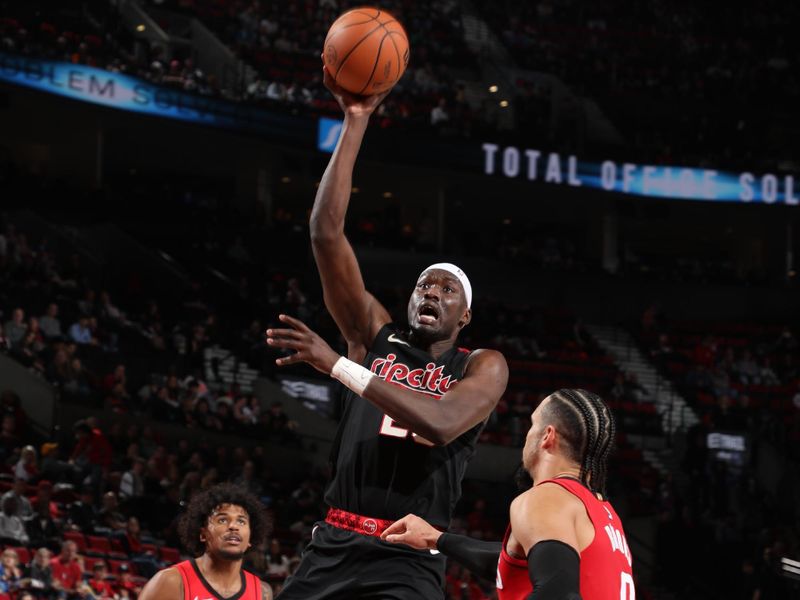 PORTLAND, OR - APRIL 12: Duop Reath #26 of the Portland Trail Blazers drives to the basket during the game against the Houston Rockets on April 12, 2024 at the Moda Center Arena in Portland, Oregon. NOTE TO USER: User expressly acknowledges and agrees that, by downloading and or using this photograph, user is consenting to the terms and conditions of the Getty Images License Agreement. Mandatory Copyright Notice: Copyright 2024 NBAE (Photo by Cameron Browne/NBAE via Getty Images)