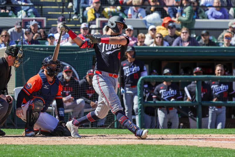 Feb 23, 2026; Lakeland, Florida, USA; Minnesota Twins second baseman Tristan Gray (4) bats during the third inning against the Detroit Tigers at Publix Field at Joker Marchant Stadium. Mandatory Credit: Mike Watters-Imagn Images