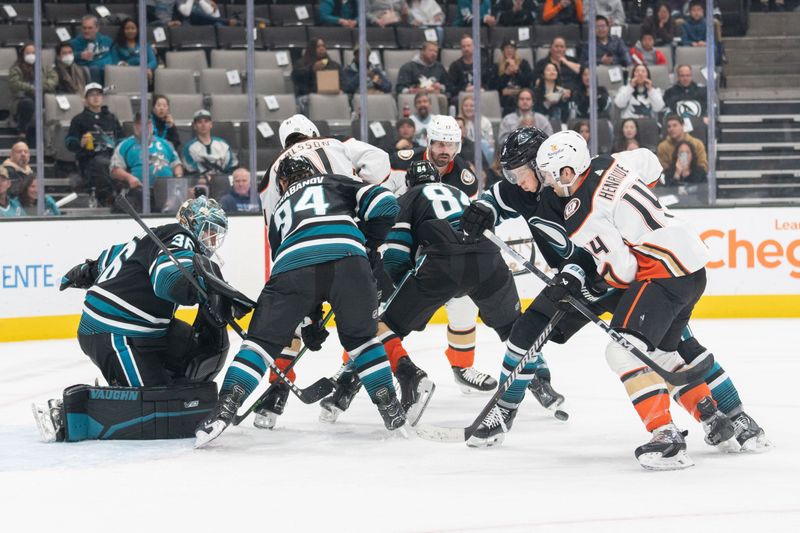 Feb 29, 2024; San Jose, California, USA; San Jose Sharks and Anaheim Ducks fight for control of the puck during the first period at SAP Center at San Jose. Mandatory Credit: Stan Szeto-USA TODAY Sports