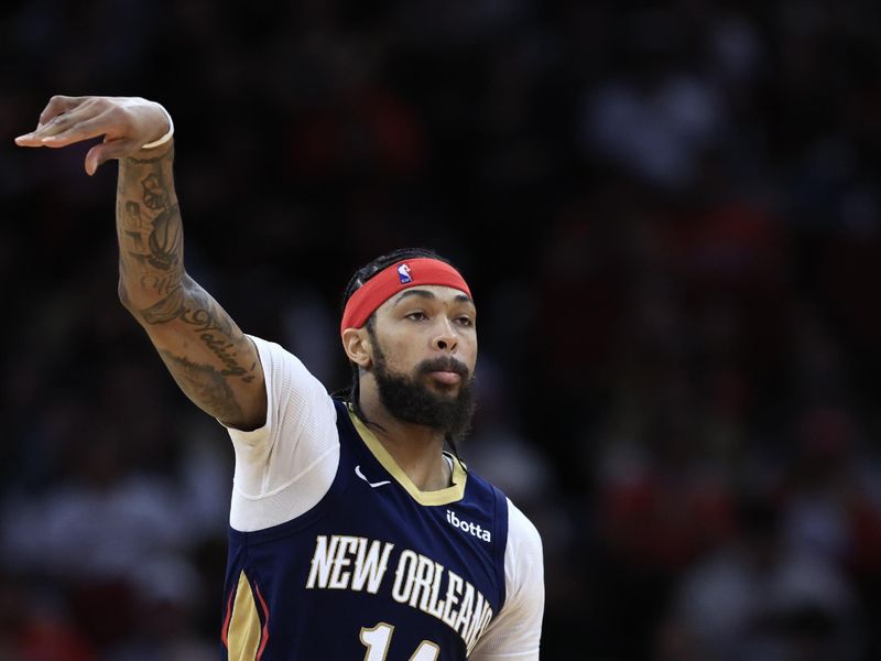 HOUSTON, TEXAS - JANUARY 31: Brandon Ingram #14 of the New Orleans Pelicans controls the ball against the Houston Rockets during the second half at Toyota Center on January 31, 2024 in Houston, Texas. NOTE TO USER: User expressly acknowledges and agrees that, by downloading and or using this photograph, User is consenting to the terms and conditions of the Getty Images License Agreement.? (Photo by Carmen Mandato/Getty Images)