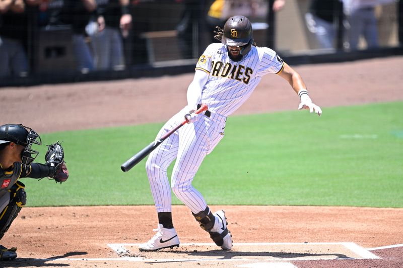 Jul 26, 2023; San Diego, California, USA; San Diego Padres right fielder Fernando Tatis (23) avoids a pitch during the first inning against the Pittsburgh Pirates at Petco Park. Mandatory Credit: Orlando Ramirez-USA TODAY Sports