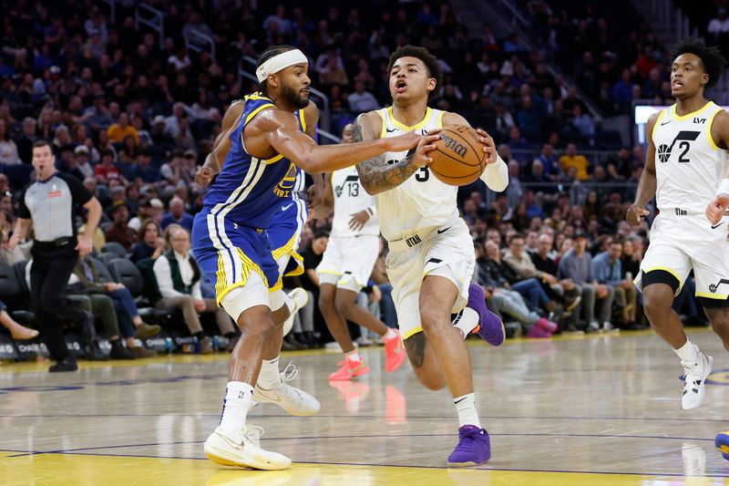 SAN FRANCISCO, CALIFORNIA - JANUARY 28: Keyonte George #3 of the Utah Jazz is fouled by Moses Moody #4 of the Golden State Warriors in the fourth quarter at Chase Center on January 28, 2025 in San Francisco, California. NOTE TO USER: User expressly acknowledges and agrees that, by downloading and or using this photograph, User is consenting to the terms and conditions of the Getty Images License Agreement. (Photo by Lachlan Cunningham/Getty Images)