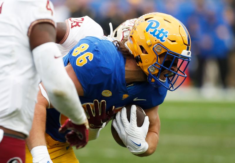 Nov 4, 2023; Pittsburgh, Pennsylvania, USA;  Pittsburgh Panthers tight end Gavin Bartholomew (86) runs after a catch against the Florida State Seminoles during the first quarter at Acrisure Stadium. Mandatory Credit: Charles LeClaire-USA TODAY Sports