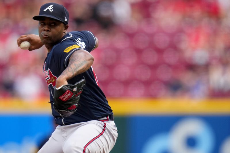 Jun 25, 2023; Cincinnati, Ohio, USA; Atlanta Braves relief pitcher Raisel Iglesias (26) delivers in the ninth inning of a baseball game against the Cincinnati Reds at Great American Ball Park. The Atlanta Braves won, 7-6. Mandatory Credit: Kareem Elgazzar-USA TODAY Sports