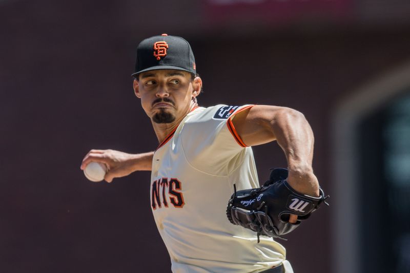 Apr 21, 2024; San Francisco, California, USA;  San Francisco Giants starting pitcher Jordan Hicks (12) throws against the Arizona Diamondbacks during the first inning at Oracle Park. Mandatory Credit: John Hefti-USA TODAY Sports