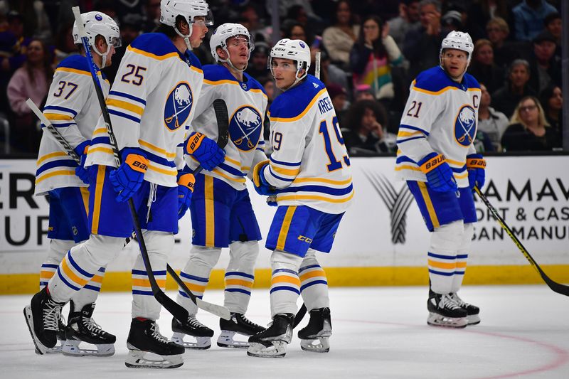 Feb 13, 2023; Los Angeles, California, USA; Buffalo Sabres center Peyton Krebs (19) celebrates his goal scored against the Los Angeles Kings with defenseman Owen Power (25) and center Casey Mittelstadt (37)  during the third period at Crypto.com Arena. Mandatory Credit: Gary A. Vasquez-USA TODAY Sports