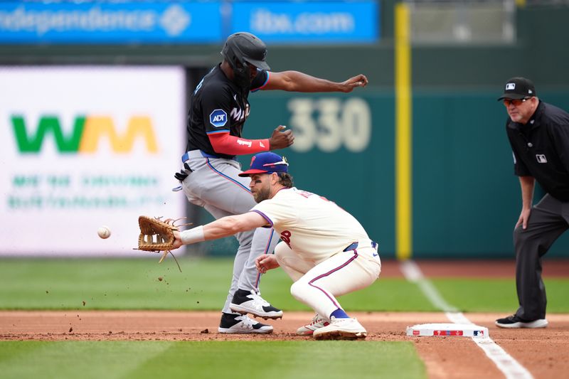 Apr 19, 2025; Philadelphia, Pennsylvania, USA; Miami Marlins outfielder Jesus Sanchez (7) jumps back to first against Philadelphia Phillies infielder Bryce Harper (3) in the first inning at Citizens Bank Park. Mandatory Credit: Kyle Ross-Imagn Images