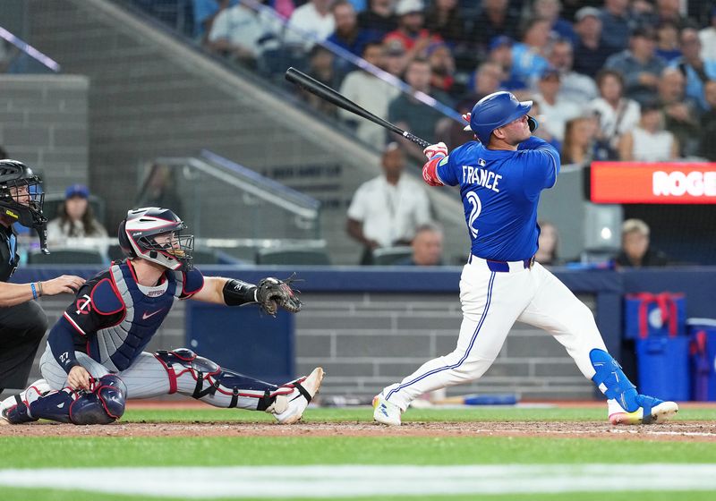 Aug 27, 2025; Toronto, Ontario, CAN; Toronto Blue Jays pinch hitter Ty France (2) hits a home run against the Minnesota Twins during the eighth inning at Rogers Centre. Mandatory Credit: Nick Turchiaro-Imagn Images