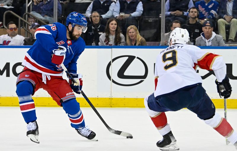 May 30, 2024; New York, New York, USA; New York Rangers defenseman Erik Gustafsson (56) controls the puck around Florida Panthers center Sam Bennett (9) during the first period in game five of the Eastern Conference Final of the 2024 Stanley Cup Playoffs at Madison Square Garden. Mandatory Credit: Dennis Schneidler-USA TODAY Sports