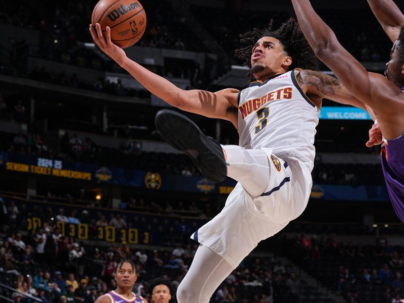 DENVER, CO - OCTOBER 13: Julian Strawther #3 of the Denver Nuggets drives to the basket during the game against the Phoenix Suns on October 13, 2024 at Ball Arena in Denver, Colorado. NOTE TO USER: User expressly acknowledges and agrees that, by downloading and/or using this Photograph, user is consenting to the terms and conditions of the Getty Images License Agreement. Mandatory Copyright Notice: Copyright 2024 NBAE (Photo by Garrett Ellwood/NBAE via Getty Images)