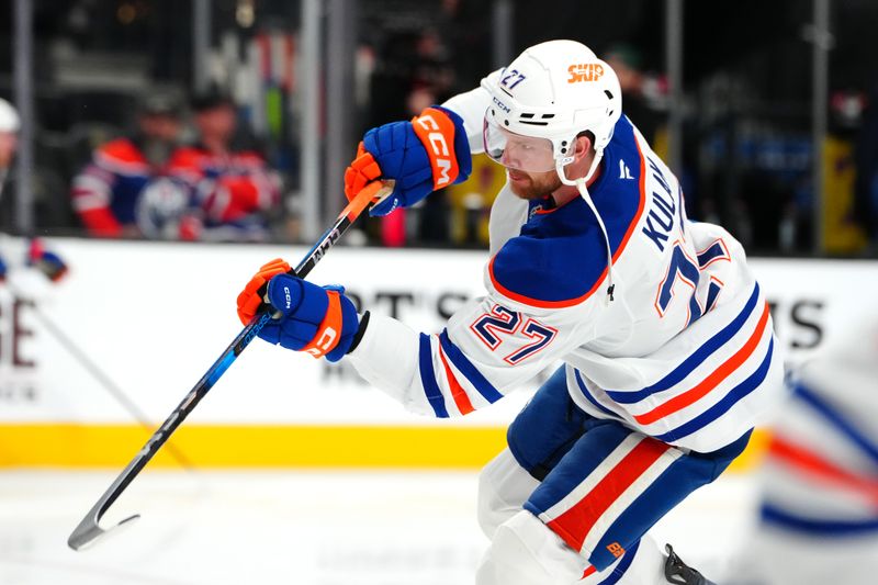 Dec 3, 2024; Las Vegas, Nevada, USA; Edmonton Oilers defenseman Brett Kulak (27) warms up before a game against the Vegas Golden Knights at T-Mobile Arena. Mandatory Credit: Stephen R. Sylvanie-Imagn Images