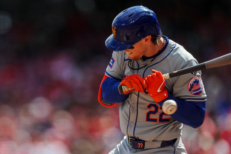 Apr 7, 2024; Cincinnati, Ohio, USA; New York Mets third baseman Brett Baty (22) dodges a wild pitch in the fifth inning in the game against the Cincinnati Reds at Great American Ball Park. Mandatory Credit: Katie Stratman-USA TODAY Sports