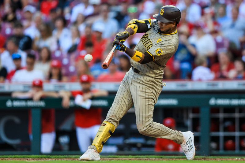 May 21, 2024; Cincinnati, Ohio, USA; San Diego Padres second baseman Luis Arraez (4) hits a single against the Cincinnati Reds in the third inning at Great American Ball Park. Mandatory Credit: Katie Stratman-USA TODAY Sports