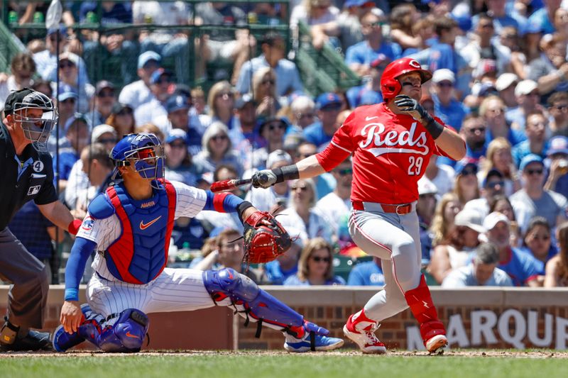 Jun 2, 2024; Chicago, Illinois, USA; 
Cincinnati Reds outfielder TJ Friedl (29) hits a three-run home run against the Chicago Cubs during the second inning at Wrigley Field. Mandatory Credit: Kamil Krzaczynski-USA TODAY Sports