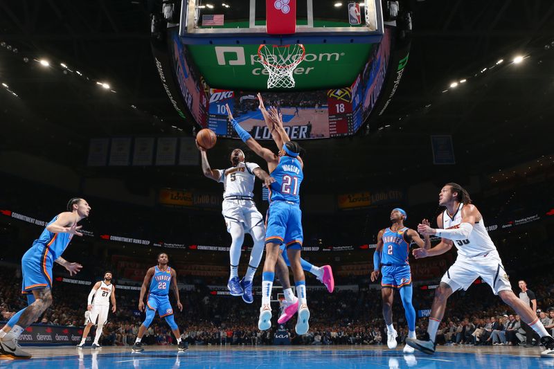 OKLAHOMA CITY, OK - JANUARY 31: Kentavious Caldwell-Pope #5 of the Denver Nuggets drives to the basket during the game against the Oklahoma City Thunder on January 31, 2024 at Paycom Arena in Oklahoma City, Oklahoma. NOTE TO USER: User expressly acknowledges and agrees that, by downloading and or using this photograph, User is consenting to the terms and conditions of the Getty Images License Agreement. Mandatory Copyright Notice: Copyright 2024 NBAE (Photo by Zach Beeker/NBAE via Getty Images)