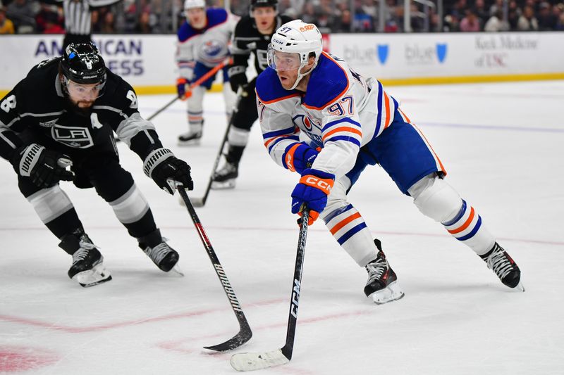 Dec 30, 2023; Los Angeles, California, USA; Edmonton Oilers center Connor McDavid (97) moves in for a shot on goal against Los Angeles Kings defenseman Drew Doughty (8) during the third period at Crypto.com Arena. Mandatory Credit: Gary A. Vasquez-USA TODAY Sports