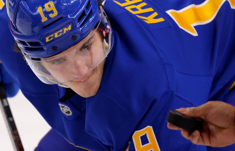 Mar 4, 2025; Buffalo, New York, USA;  Buffalo Sabres center Peyton Krebs (19) waits for the linesman to drop the puck for a face-off during the second period against the San Jose Sharks at KeyBank Center. Mandatory Credit: Timothy T. Ludwig-Imagn Images