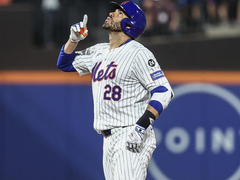 Aug 14, 2024; New York City, New York, USA;  New York Mets designated hitter J.D. Martinez (28) gestures after hitting an RBI double in the seventh inning against the Oakland Athletics at Citi Field. Mandatory Credit: Wendell Cruz-USA TODAY Sports