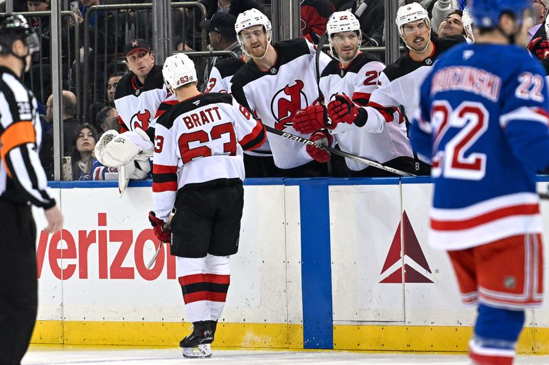 Dec 2, 2024; New York, New York, USA;  New Jersey Devils left wing Jesper Bratt (63) celebrates his goal against the New York Rangers with teammates during the first period at Madison Square Garden. Mandatory Credit: Dennis Schneidler-Imagn Images