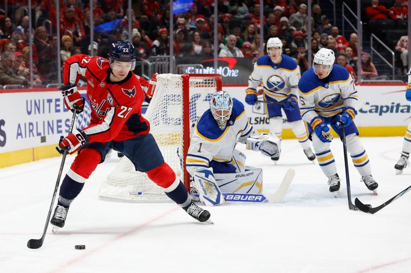 Dec 14, 2024; Washington, District of Columbia, USA; Washington Capitals right wing Brandon Duhaime (22) skates with the puck behind Buffalo Sabres goaltender Ukko-Pekka Luukkonen (1) in the first period at Capital One Arena. Mandatory Credit: Geoff Burke-Imagn Images